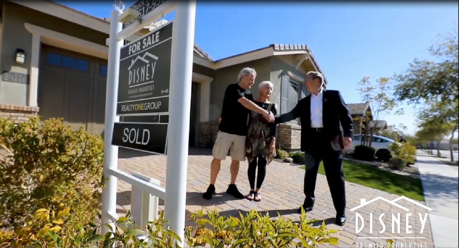 Chuck Disney Shaking Hands With Clients