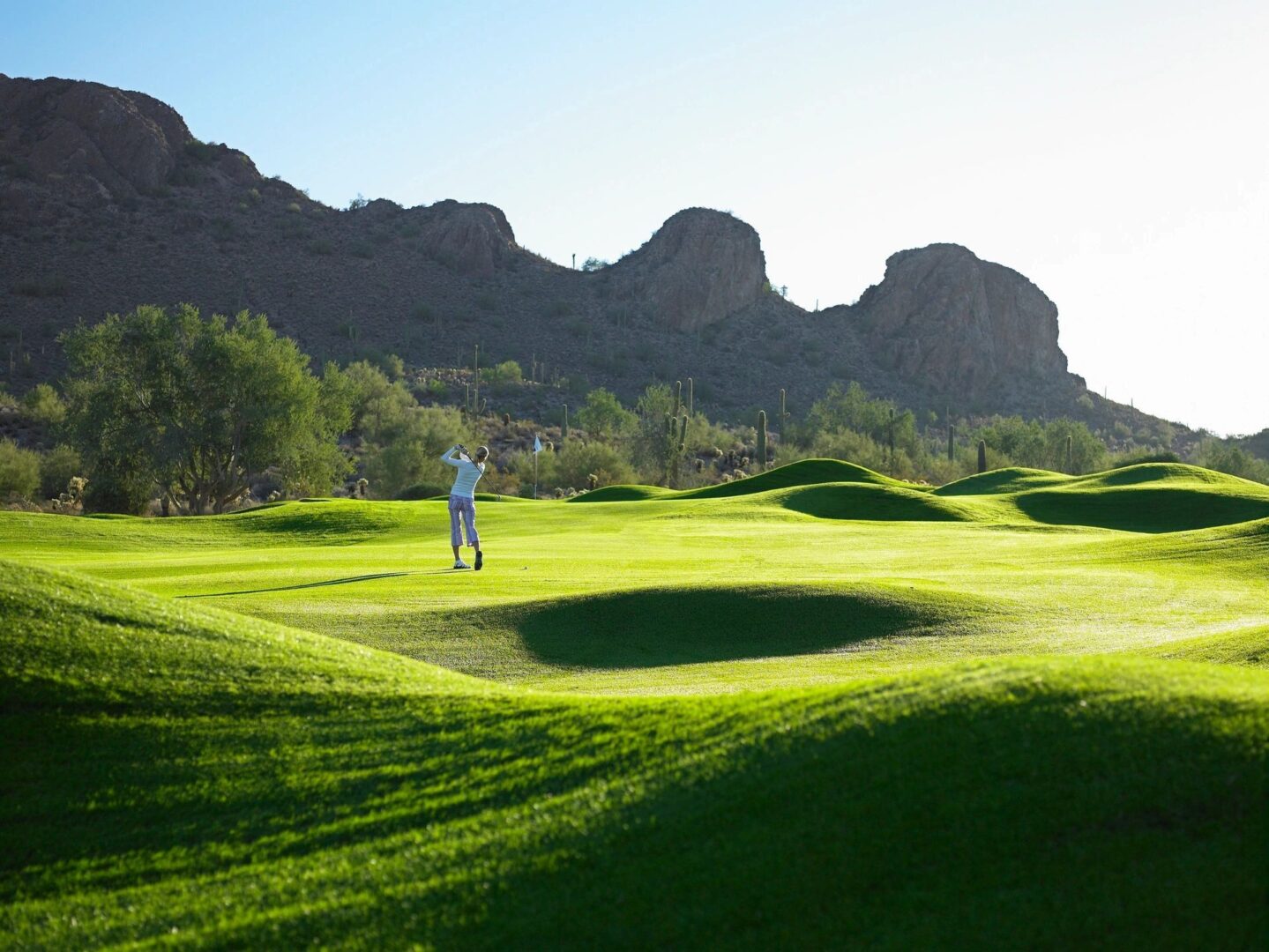 The Back of a Woman Playing Golf